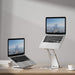 Sleek and modern silver laptop stand with a laptop displayed, buy now from TaMiMi Projects in Qatar.