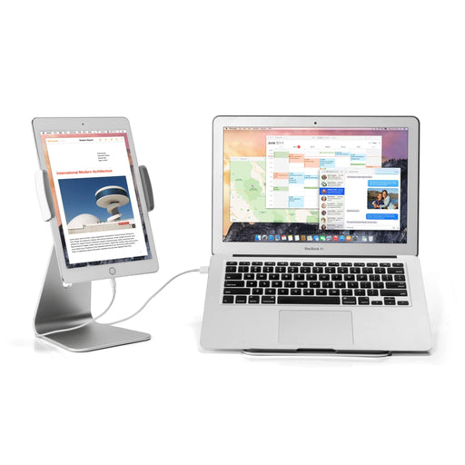 Tablet on a silver stand next to a desktop monitor, ideal for a dual-device workspace.